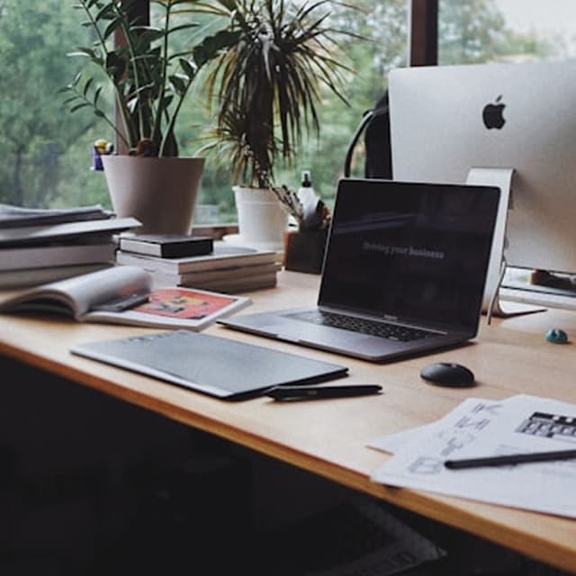 Product design workspace with iMac showing a UI project